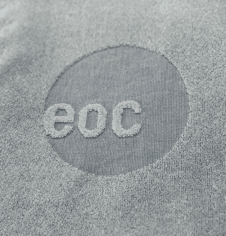 Folded terry towels in earthen tones